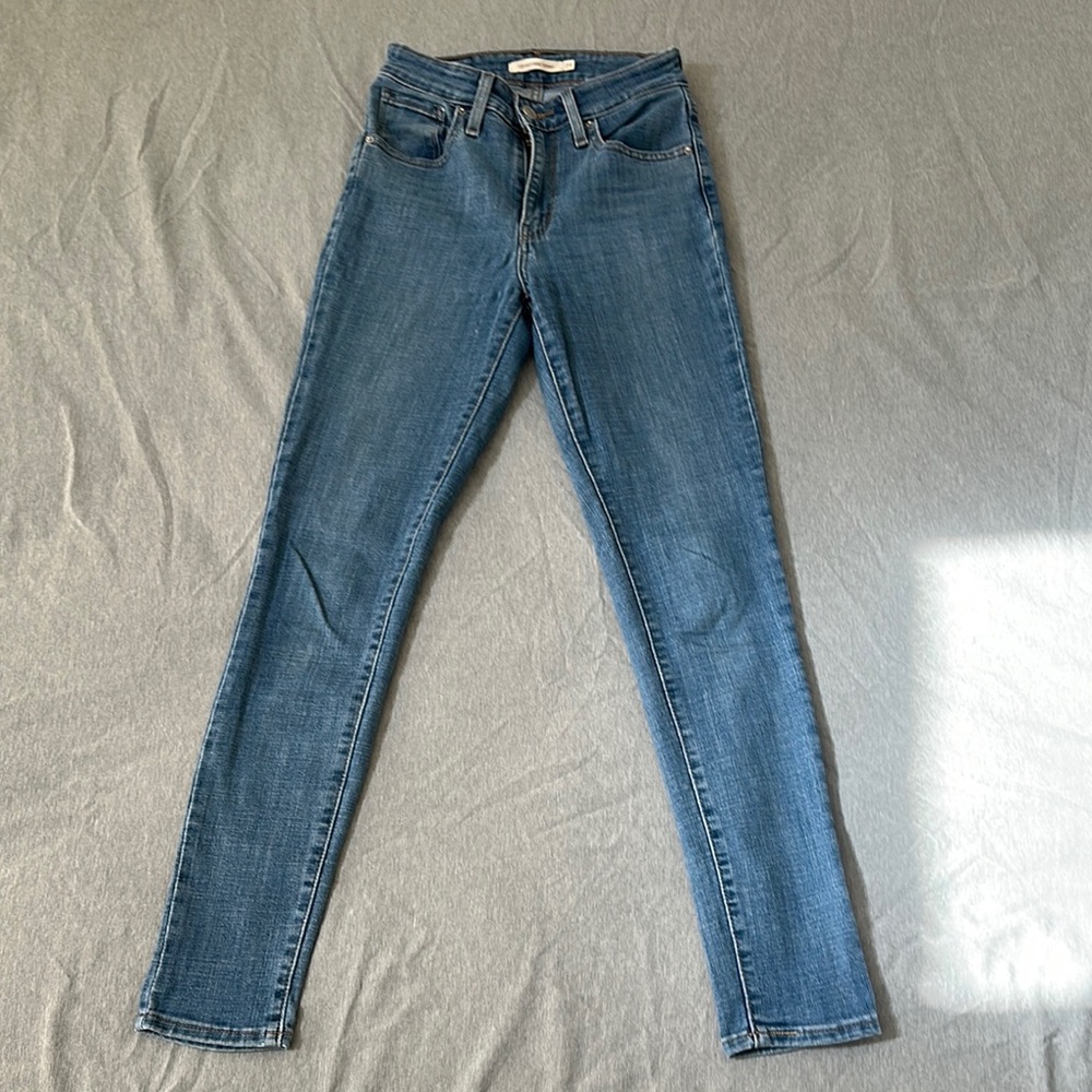 721 High Rise Skinny Blue Denim Jeans with Faded Details